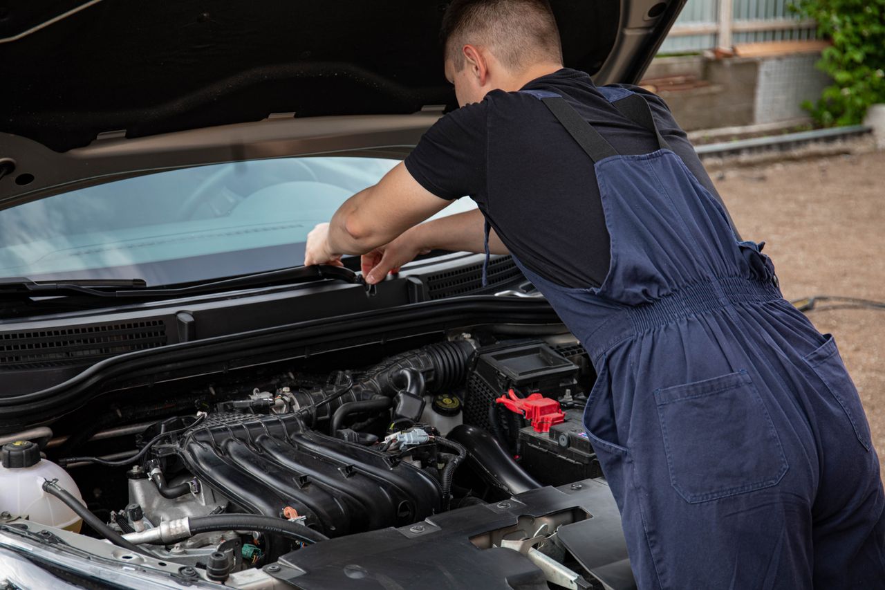 Mobile mechanic working on car in driveway in East GTA Ontario